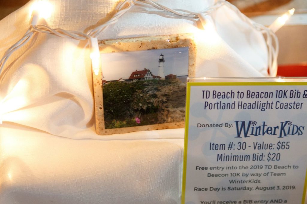 WinterKids License to Chill 2018 Auction Items TD Beach to Beacon 10K Bib and Coaster Stephen Davis Photo