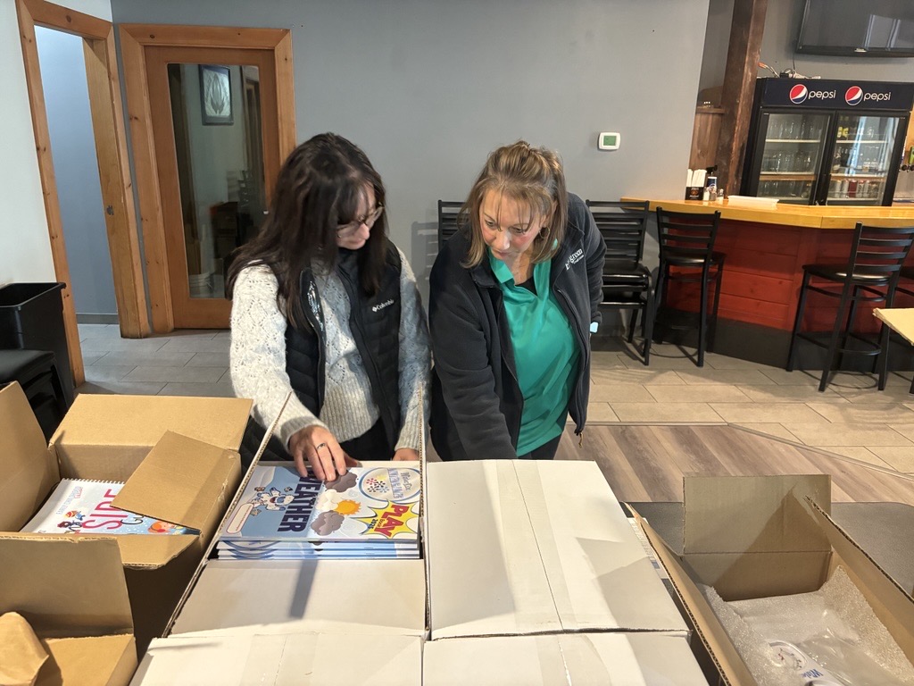 Evergreen Credit Union team members helping prepare Winter Games toolkits in 2024.